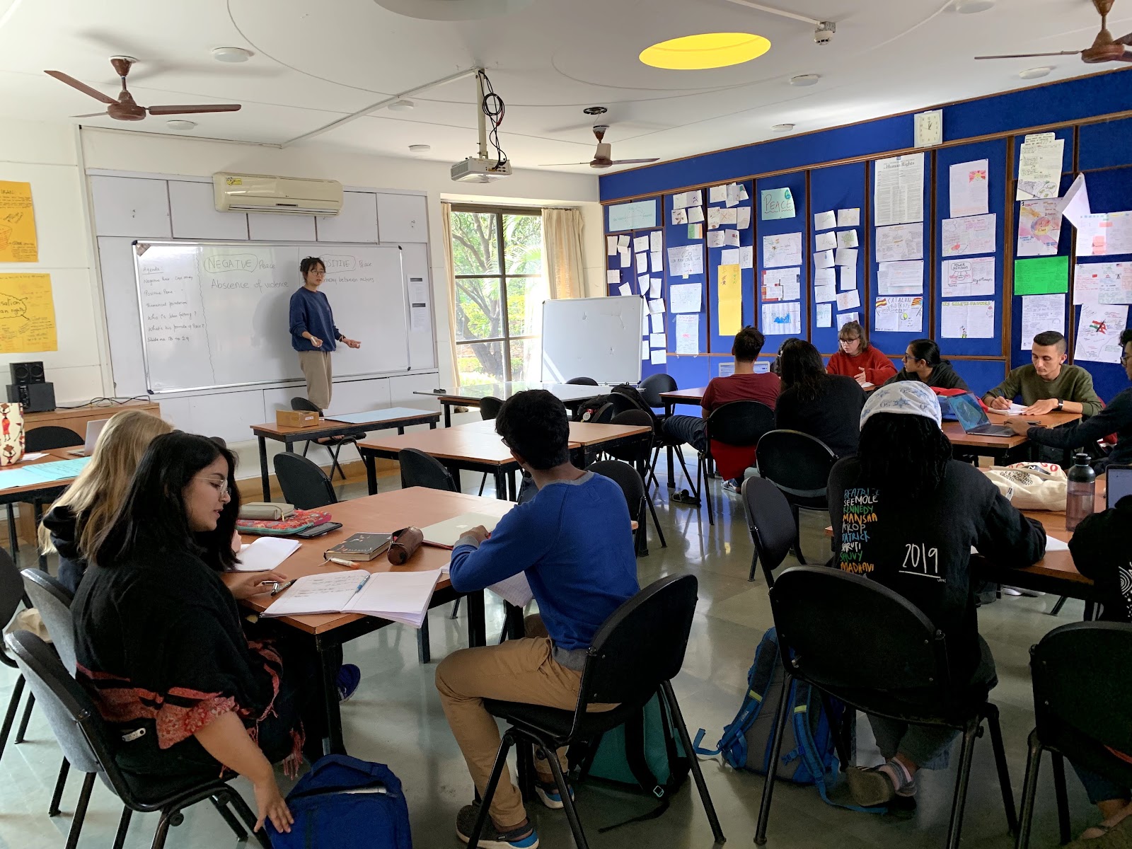 A Global Politics lesson in progress, negative and positive peace written on the whiteboard