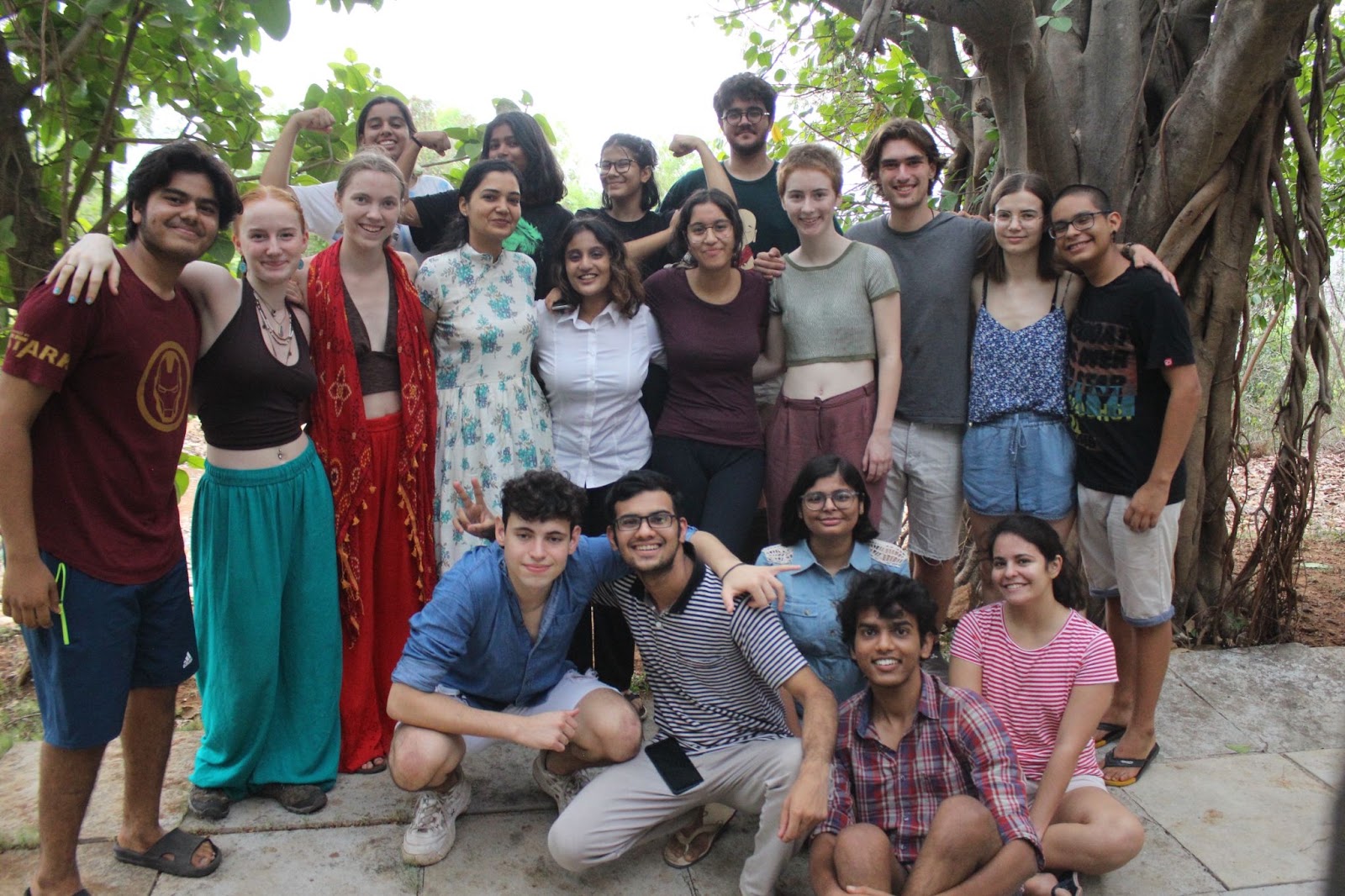 The class photographed outdoors under a banyan tree